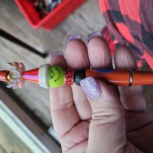 Festive Grinch Pen with Red and Green Accents